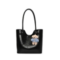 Sleek black faux leather tote bag with a cute teddy bear charm and embossed logo detail - Black With Blue Sweater Teddy Dog Charm
