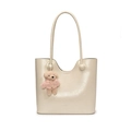 Minimalist off-white bucket bag with plush bear charm and sleek leather finish - White With Pink Sweater Teddy Dog Charm