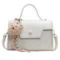 White structured minimalist handbag with asymmetric flap and bear charm accessory - Bear Charm With Knot / Off White