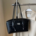 Glossy black tote bag with embossed cartoon bear patterns and knot strap detail - Black