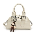 Chic beige Boston handbag in motorcycle style with a cute plush charm and silver hardware - With Doll Keychain / White