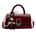 Elegant burgundy small square handbag in shiny finish with a pearl doll pendant charm - Wine Red With Cartoon Pendant