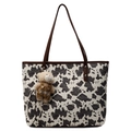Cow print canvas tote bag with brown leather handles and a plush bear pendant charm - Brown With Teddy Bear Charm