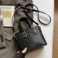 Minimalist black woven bucket bag with golden rivets and adjustable shoulder strap - No Pendant / Black