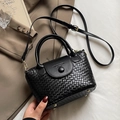 Elegant black woven texture bucket bag with top handle and adjustable shoulder strap - Black (Without Charm)