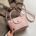 Pink woven bucket bag with adjustable strap and golden hardware in a casual style - Pink (No Charm)