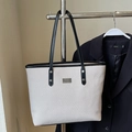 Minimalistische cremefarbene Tote Bag mit schwarzem Besatz und Lederriemen für den Alltag - Ohne Anhänger / Grau