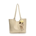 Minimalist beige tote bag with a cute brown plush dog charm and yellow bow accessory - White + Yellow Bow Pearl Gromit