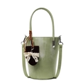 Minimalist light green bucket bag with brushstroke texture and white lace bow detail - Green