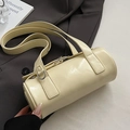 Creamy beige cylindrical barrel bag in glossy leather with shoulder strap and metal hardware - Yellow - No Pendant