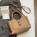 Minimalist khaki litchi grain leather bucket bag with gold hardware and shoulder strap - No Pendant / Khaki