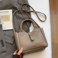 Taupe lychee grain leather bucket bag with dual handles and adjustable shoulder strap - No Pendant / Elephant Gray