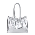 Chic silver metallic tote bag featuring drawstring closure and delicate bow accents - Silver