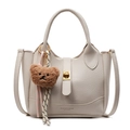 Chic beige lychee leather bucket bag with a cute brown plush bear charm and gold hardware - Bear Charm With Knot / Off White