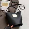 Minimalist black lychee pattern bucket bag with white logo and delicate bead strap detail - Black - Without Pendant