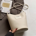 Minimalist cream white lychee leather bucket bag with brand patch and thin strap - White without Pendant