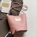 Pink litchi texture bucket bag with HAMIROO label and decorative purple bead detail - Pink - No Pendant