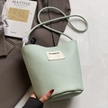 Mint green litchi texture bucket bag with HAMIROO label and white decorative bead details - Green - No Charm