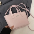 Pink faux leather minimalist bucket bag with dual handles and adjustable shoulder strap - No Pendant / Pink