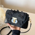 Elegant black crossbody bag featuring 3D butterfly embroidery and gold metal clasp - Black