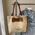 Bolso tote de lona beige versátil con bolsillo en forma de hueso y asas de cuero - Caqui - Sin Colgante