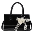 Minimalist black patent leather handbag with pearl heart charm and lace bow detail - Black