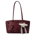 Chic burgundy snake-embossed tote bag with elegant pearl lace bow charm detail - Ancorra Red