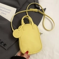 Chic yellow lychee leather mini crossbody bag with smiley charm and adjustable strap - Yellow - No Pendant