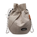 Beige lightweight nylon drawstring bucket bag with Lucky patch and braided strap - Off White
