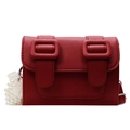 Red pebbled leather crossbody bag with dual buckles and decorative pearl lace chain - Aura Red