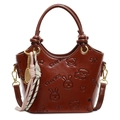 Dark brown embossed retro bucket bag with animal patterns and woven tassel pendant - With Abacus Racket Knot Pendant / Brown