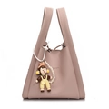 Fashionable dusty rose litchi leather bucket bag with pearl chain and fashion embossing - Yellow Girl Pendant / Pink