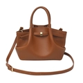 Detail of caramel brown lychee grain faux leather handbag with golden metal buckle - Caramel Brown