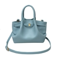 Detail of light blue lychee pattern leather tote with gold lock and pleated design - Blue