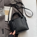 Classic black litchi pattern bucket bag with detachable strap on a grey blazer - No Pendant / Black