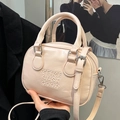 Pink bowling style crossbody bag with embossed lettering and silver hardware - Pink - No Pendant
