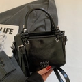 Minimalist black oil wax leather bucket bag with glossy finish and silver metal logo - Black - Without Pendant