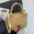 Chic light yellow glossy oil wax leather bucket bag with silver metal logo and strap - Yellow - No Pendant