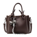 Brown lychee pattern leather bucket bag with metallic bow charm and woven strap - Coffee Style - With Pendant