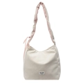 Chic cream tote bag with pink drawstring bow detail and ruffled shoulder strap - Off White