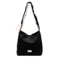 Large black leather tote bag with contrast shoulder straps and brand tag on white background - Black