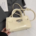 Minimalist cream oil wax leather bucket bag with metal turn-lock and top handle - No Pendant / Yellow