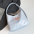 Light blue faux leather tote bag with pink lace bow and tennis racket charm detail - Blue with Pendant