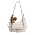 White crescent tote bag in glossy PU leather with silver buckle and dog keychain - White With Plush Dog Pendant