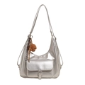 Silver metallic fashion tote bag with stylish buckle pockets and brown plush puppy charm - Silver With Plush Dog Pendant