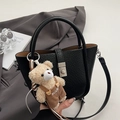 Minimalist black pebble leather bucket bag with a cute plush bear charm accessory - With Bear Pendant / Black