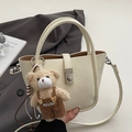 Chic beige lychee textured bucket bag with silver lock and teddy bear charm - With Bear Pendant / Off White