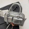 Silver metallic Boston handbag with twin pockets and detachable strap in mirror finish - Without Pendant / Silver - No Charm