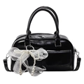 Elegant black patent leather Boston bag featuring a large white lace pearl bow charm - Black + Mesh Artificial Pearl Bow