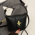 Elegant black lychee textured leather bucket bag with golden twist lock and shoulder strap - No Pendant / Black